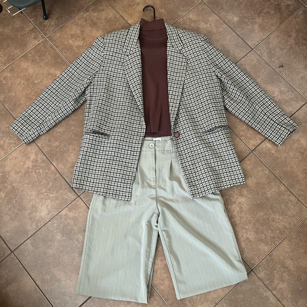 Checked Blazer with Brown Knit Top and beige and white Pinstripe Trousers
